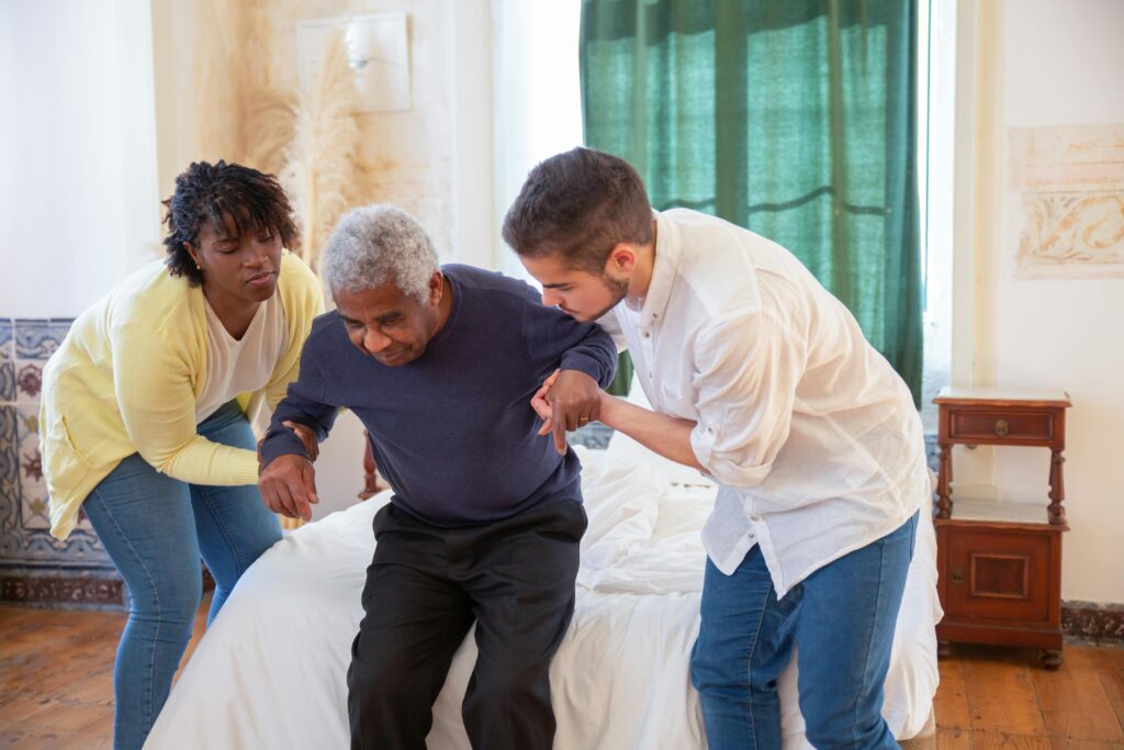 Caregivers assisting an older adult